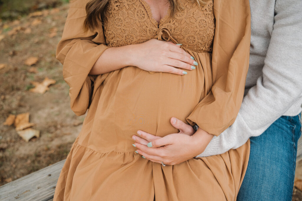 Parents holding belly 