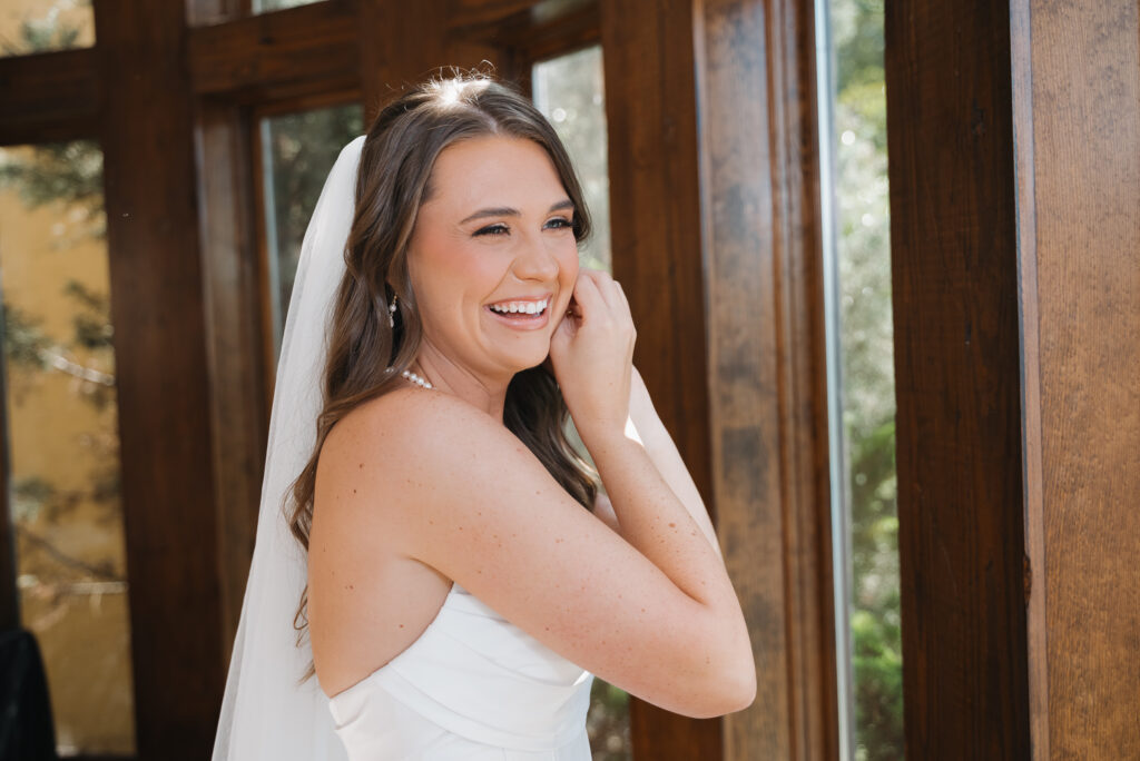 Bride getting ready in Bella Collina Bridal Suit 