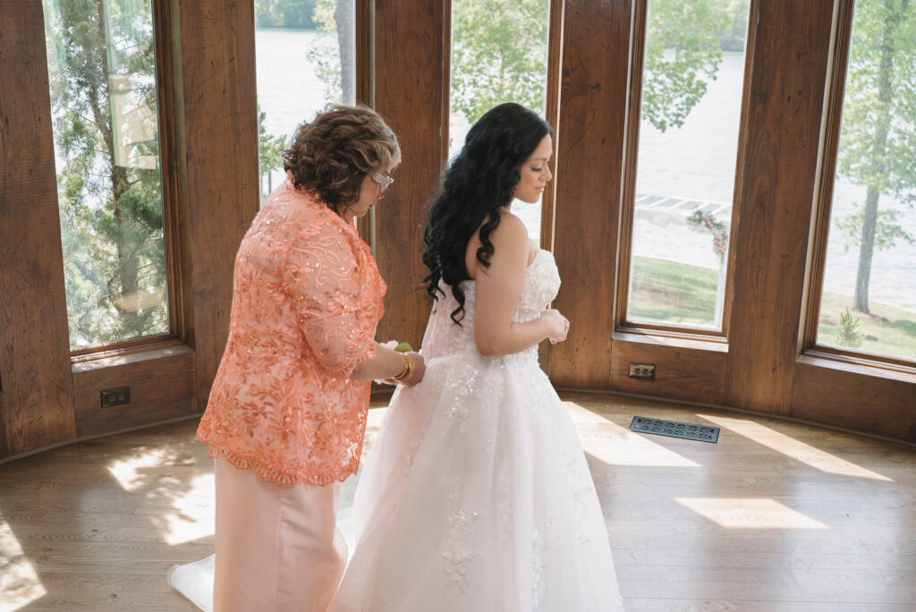 Bride getting into dress